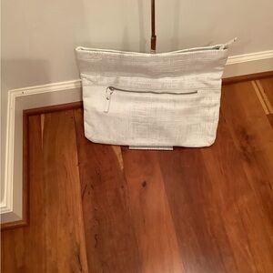 Pietro Alessandro perforated clutch in white.